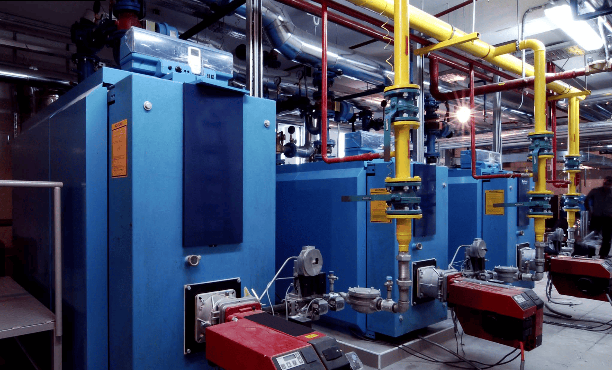 Expert McLeod Mechanical technicians installing commercial HVAC system in Calgary - safety-first approach with superior craftsmanship